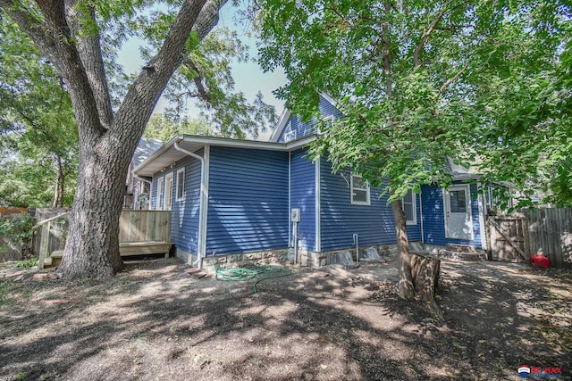 view of front of property featuring a wooden deck