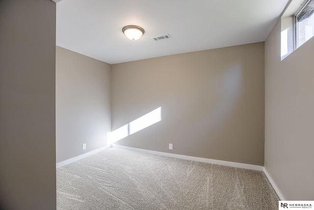 spare room with carpet floors