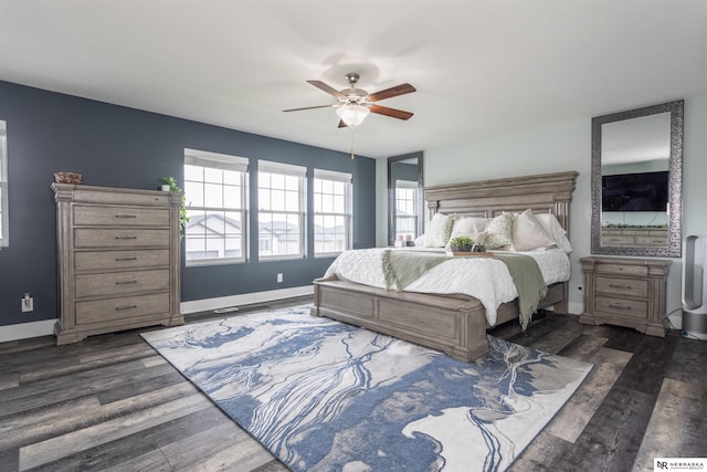 bedroom featuring ceiling fan and dark hardwood / wood-style floors