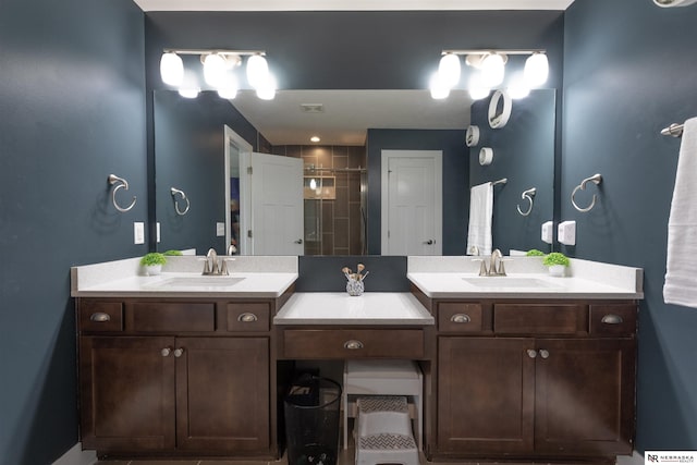 bathroom featuring vanity and an enclosed shower