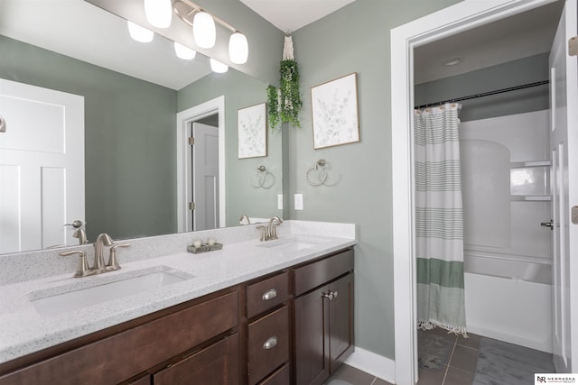 bathroom with tile patterned flooring and vanity