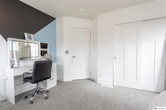 office area featuring light colored carpet