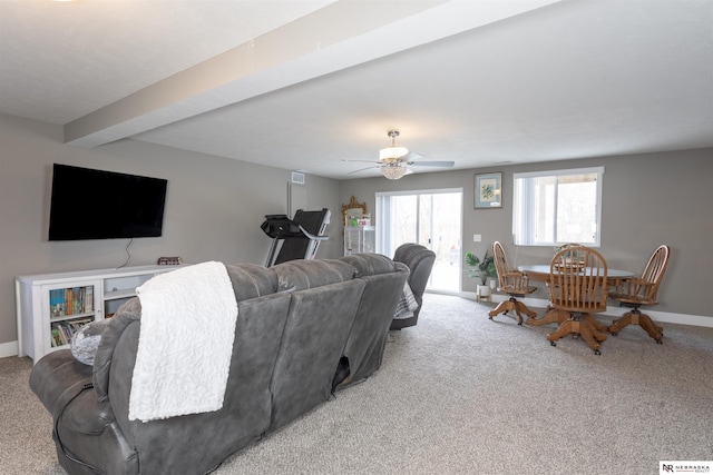 living room with beamed ceiling, light carpet, and ceiling fan