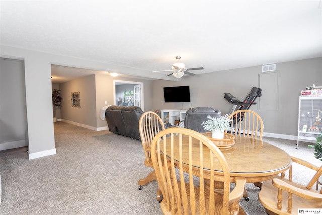 dining room featuring ceiling fan and carpet floors