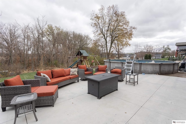 view of patio / terrace with an outdoor hangout area and a playground