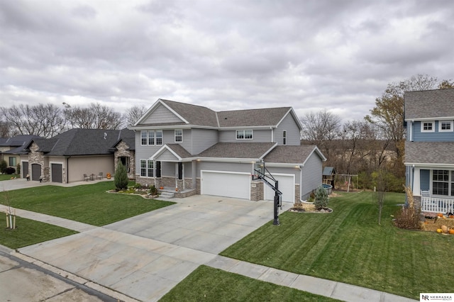 view of property featuring a front lawn and a garage