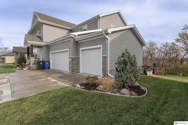 view of property exterior featuring a yard and a garage