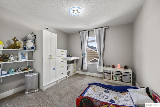 bedroom with a textured ceiling and light carpet