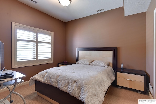 bedroom featuring light carpet