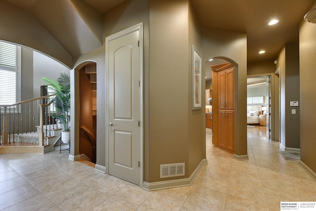 hallway featuring light tile patterned floors