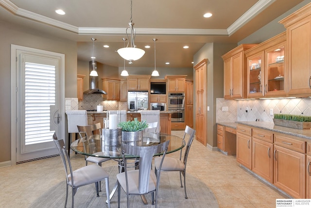 dining space with light tile patterned floors, a raised ceiling, and ornamental molding