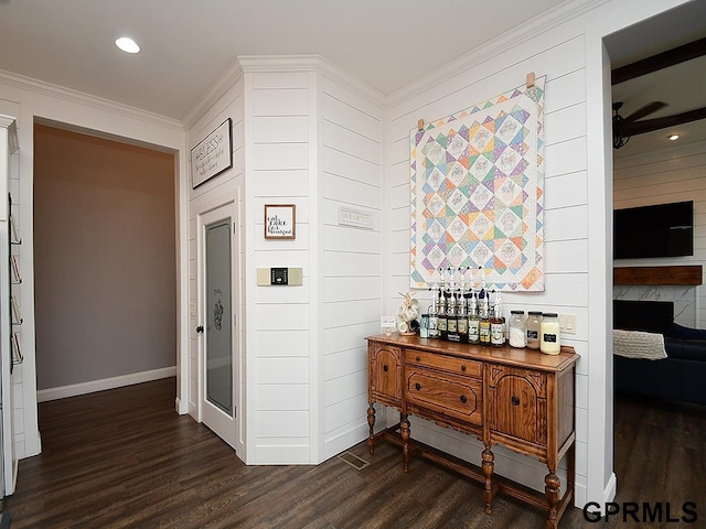 corridor featuring ornamental molding and dark wood-type flooring