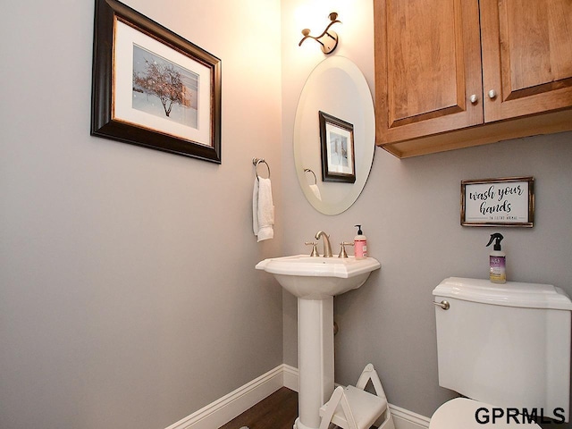 bathroom with toilet and sink