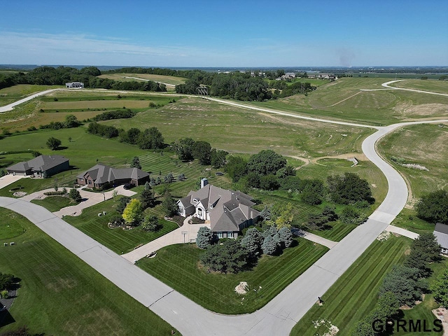 birds eye view of property featuring a rural view