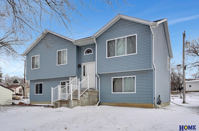 view of snow covered property