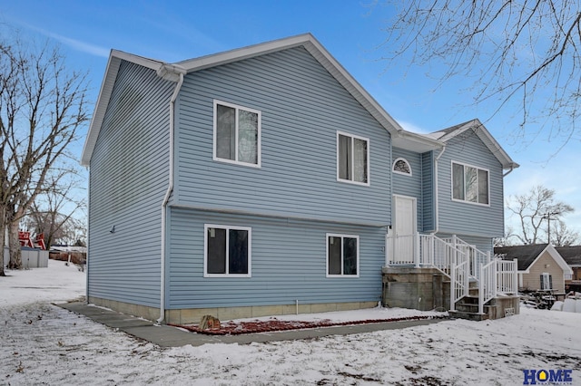 view of snow covered house