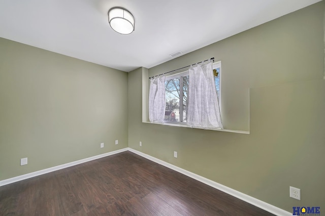 empty room featuring hardwood / wood-style flooring