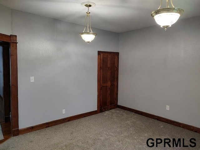 spare room featuring carpet flooring