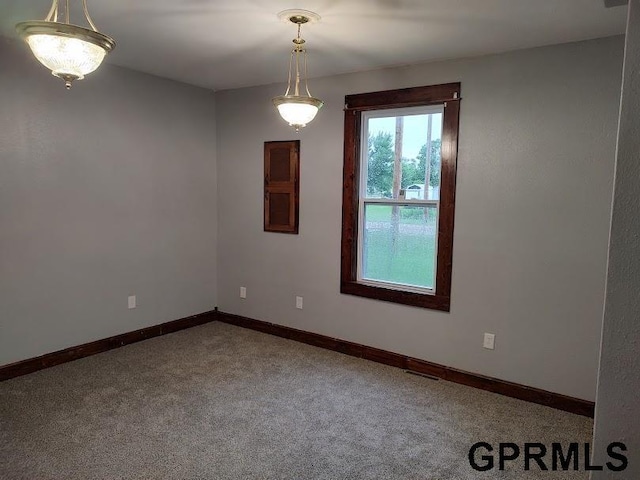 unfurnished room featuring carpet flooring