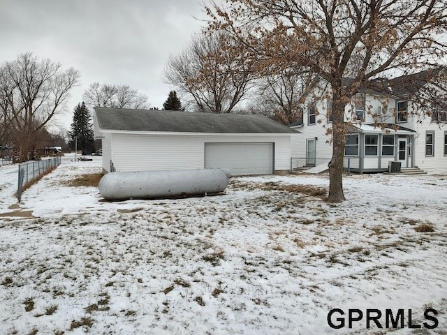 view of snow covered garage