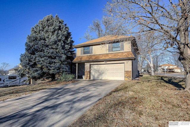 view of front of home featuring a garage and a front lawn