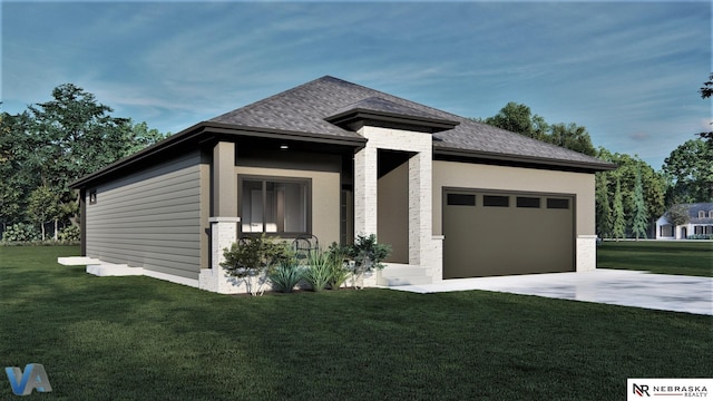 prairie-style home with a front yard and a garage