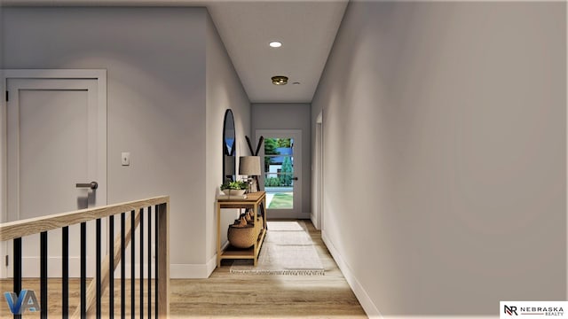 hallway with light hardwood / wood-style floors