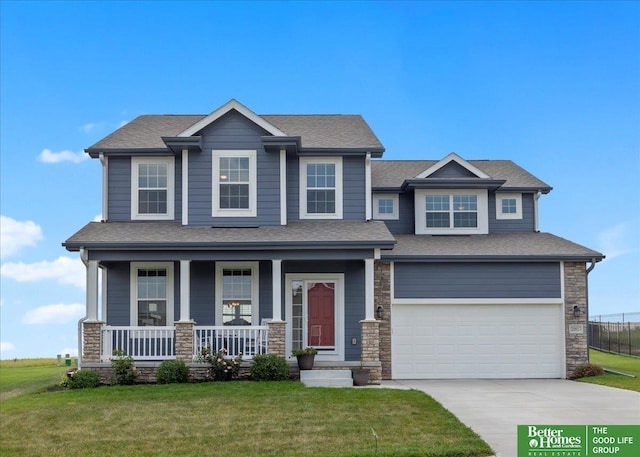 craftsman house featuring a front yard, a porch, and a garage