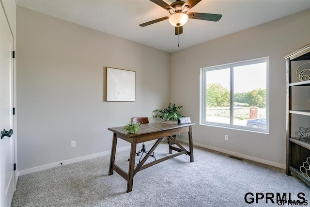 home office featuring ceiling fan and light colored carpet