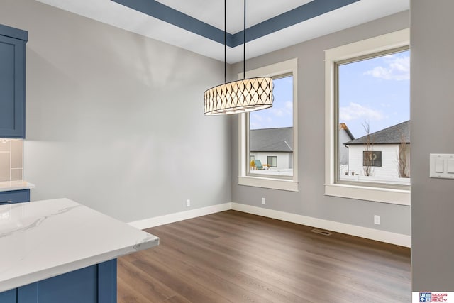 dining area featuring dark hardwood / wood-style flooring