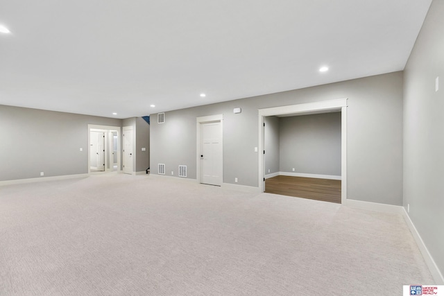 basement with light colored carpet