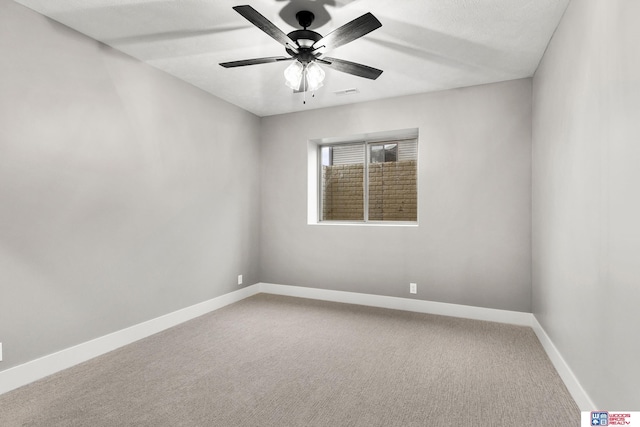 unfurnished room featuring ceiling fan and carpet floors