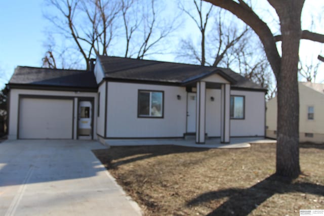 single story home featuring a garage