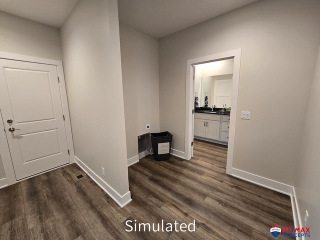 hallway with dark hardwood / wood-style floors and sink