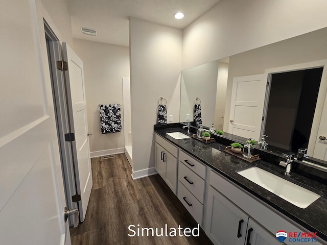 bathroom featuring wood-type flooring and vanity