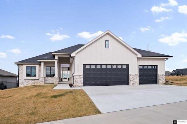 modern farmhouse featuring a garage and a front yard