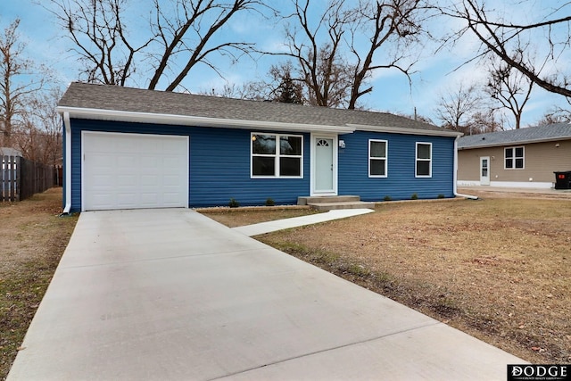 single story home with a front yard and a garage