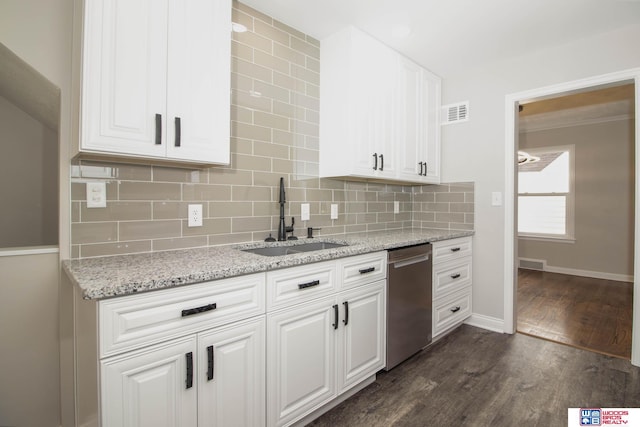 kitchen with light stone countertops, stainless steel dishwasher, sink, dark hardwood / wood-style floors, and white cabinetry