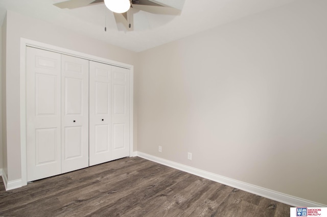 unfurnished bedroom with ceiling fan, a closet, and dark wood-type flooring