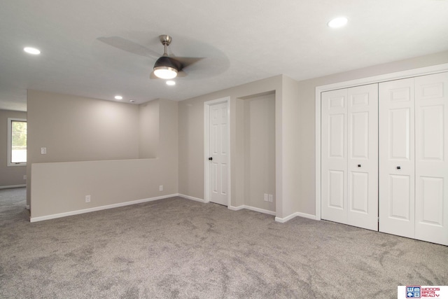 unfurnished bedroom with carpet floors and ceiling fan