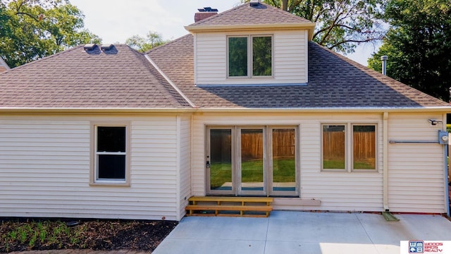 rear view of property featuring a patio area