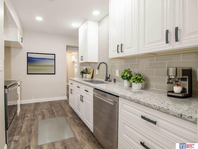 kitchen featuring appliances with stainless steel finishes, dark hardwood / wood-style floors, white cabinetry, and sink