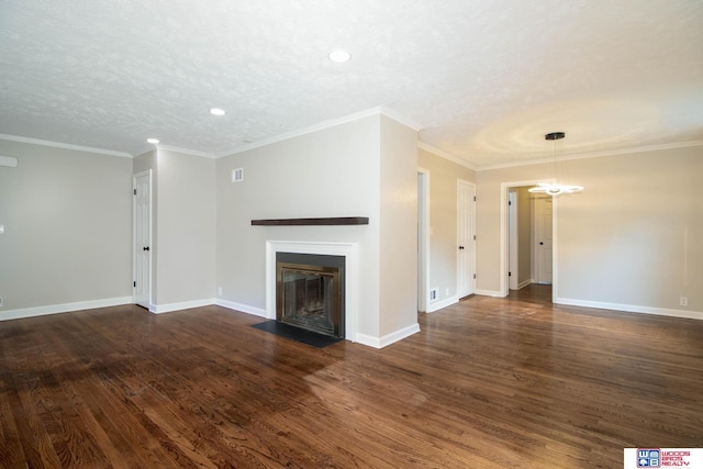 unfurnished living room with a textured ceiling, dark hardwood / wood-style floors, and ornamental molding