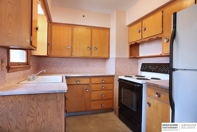 kitchen featuring white appliances, sink, and tasteful backsplash