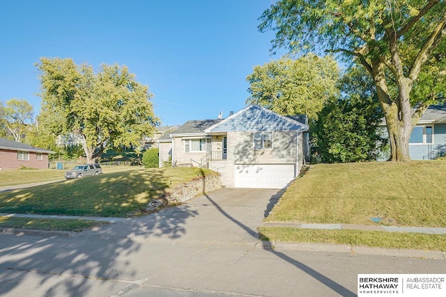 view of front of house with a front yard and a garage