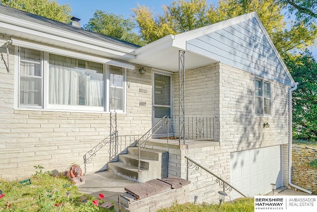 property entrance featuring a garage