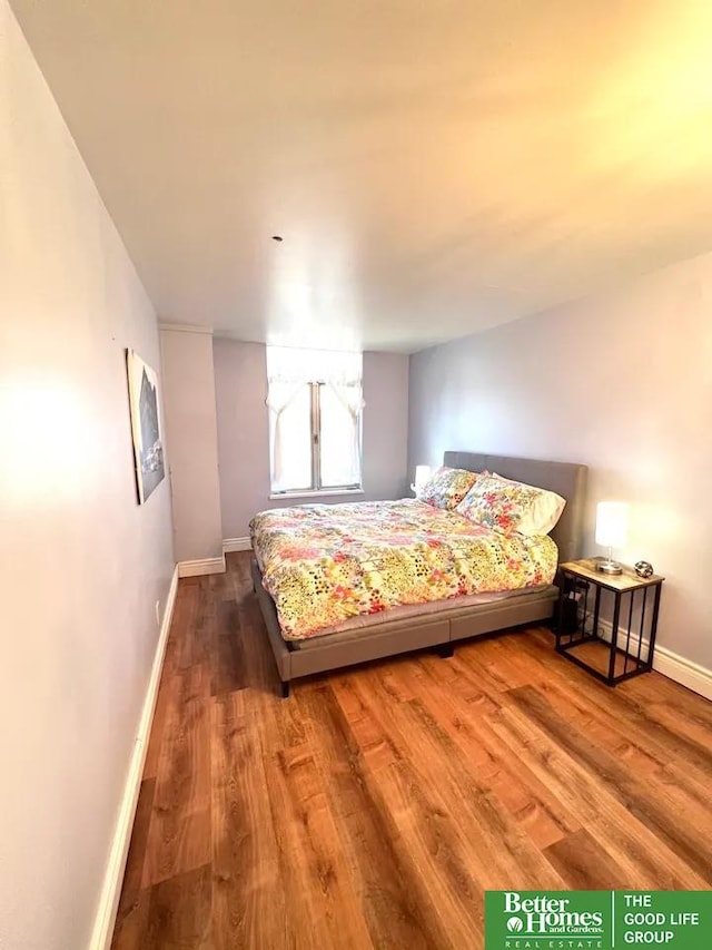 bedroom with wood-type flooring