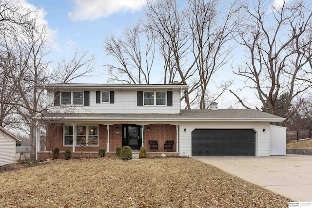 view of property with a front yard, a porch, and a garage