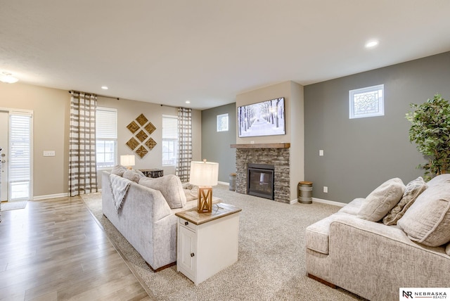 living room with a fireplace and light hardwood / wood-style floors