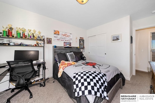 bedroom with light carpet and a closet